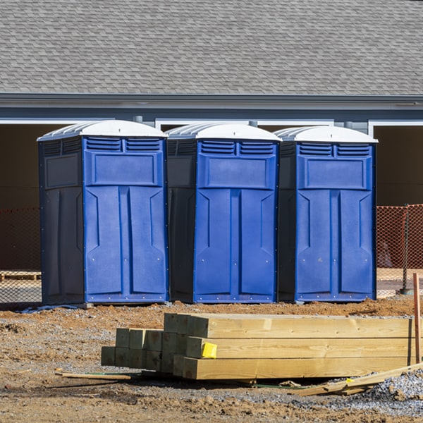 what is the cost difference between standard and deluxe porta potty rentals in Westby